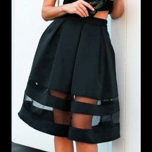 Express stripes black skirt with sheer panels.