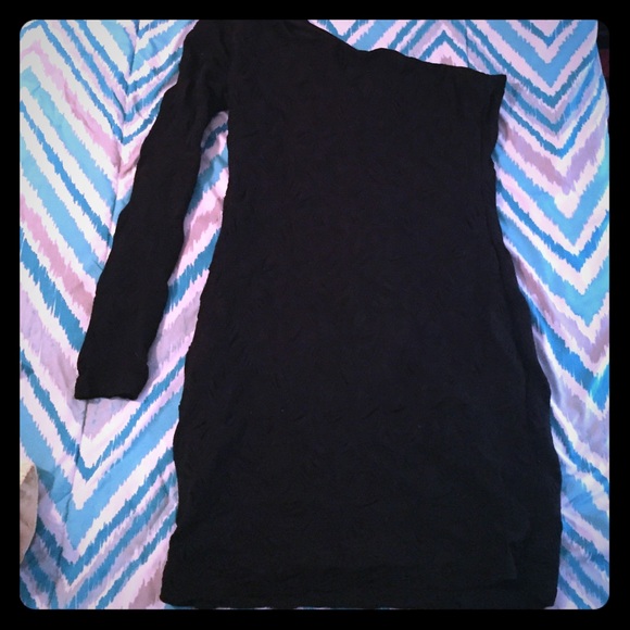 One long sleeve, black stretchy dress.