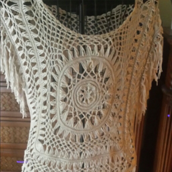Crochet tan sweater short sleeve fringe.