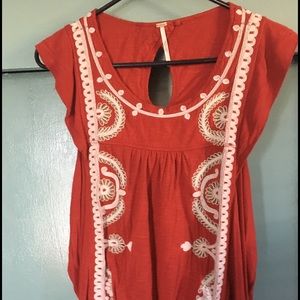 Red free people with white detail shirt