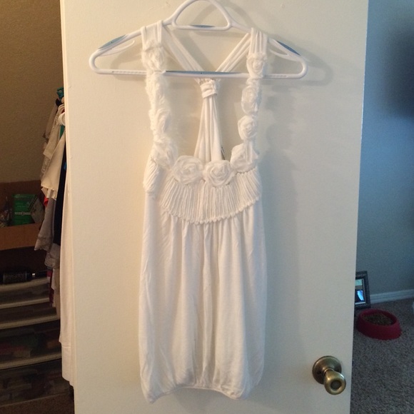 White tank with rosette detailing on shoulders