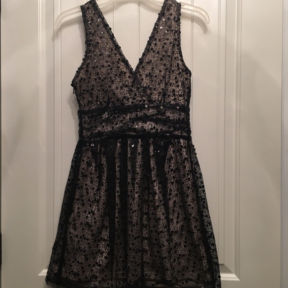 Black sequin and mesh cocktail dress nude underlay