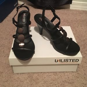 Black strappy heels with bronze center stones