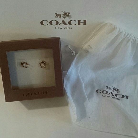 Authentic Coach earrings!!! Rose colored metal