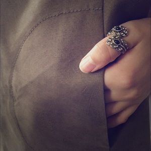 Metal Feather Detail And Black Stone Ring