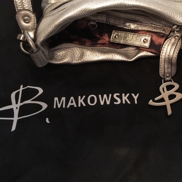 b. Makowsky cross body silver metallic small bag.
