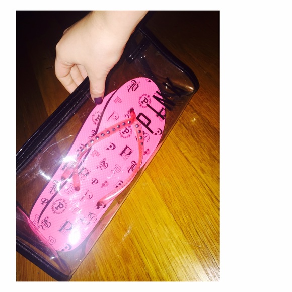 Pink flip flops and bag