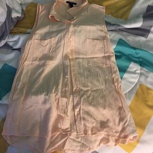 a cream colored sleeves blouse