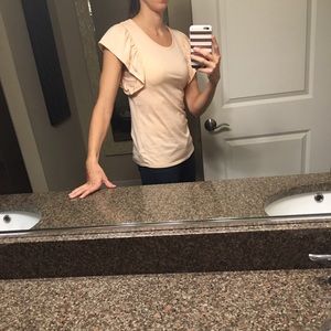 Peach sleeveless top with arm ruffle