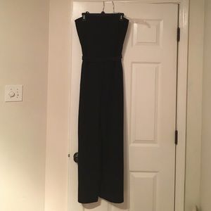 Black strapless jumpsuit with belt and pockets