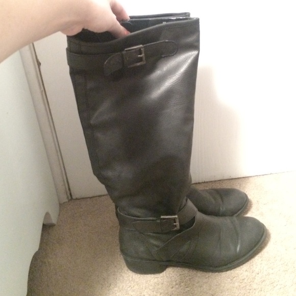 tall black boots w/zipper on one side and buckles