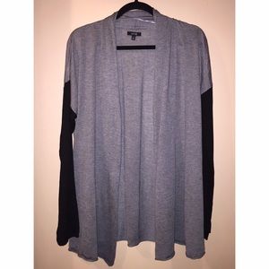grey open cardigan with black sleeves
