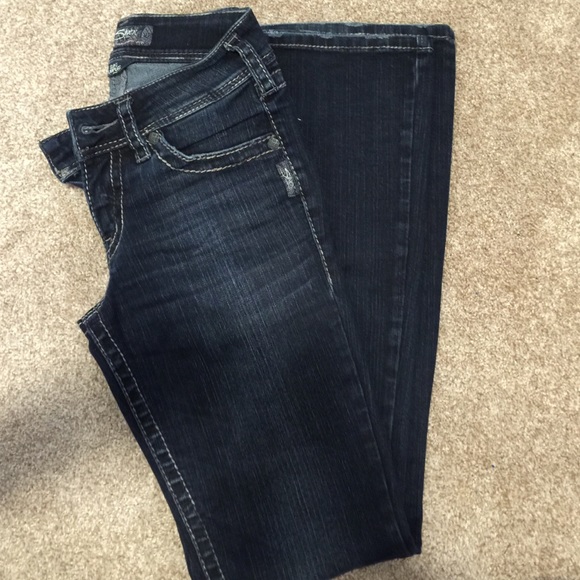 Silver, dark wash jeans in new condition