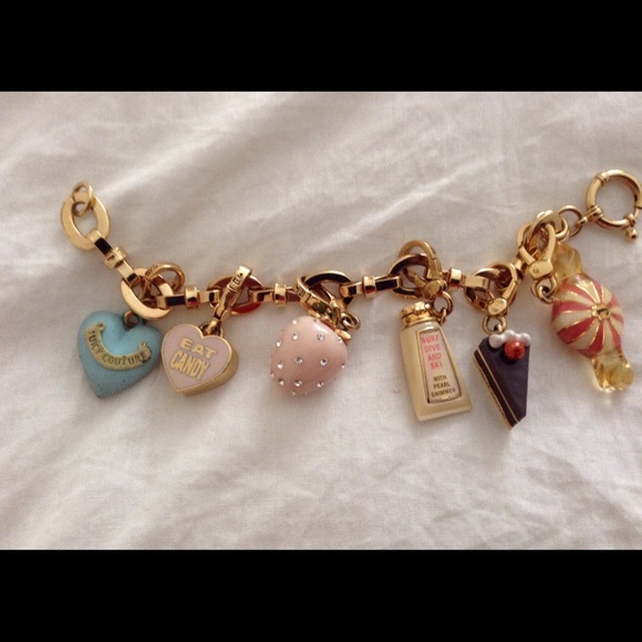 Charm bracelet with all the charms Color is gold