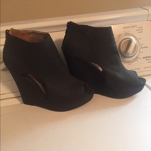 Peep toe black wedge.