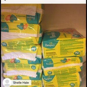 Nine brand new packages of diapers