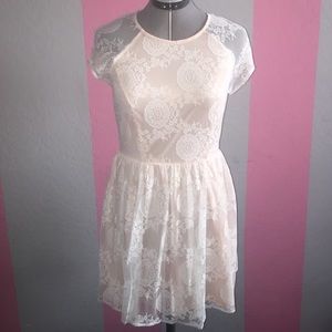 Cream colored dress with off white lace overlay