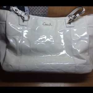 A coach patent leather purse.