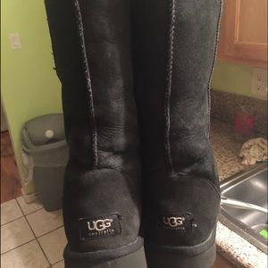 Black tall ugg boots. Worn as shown in picture!