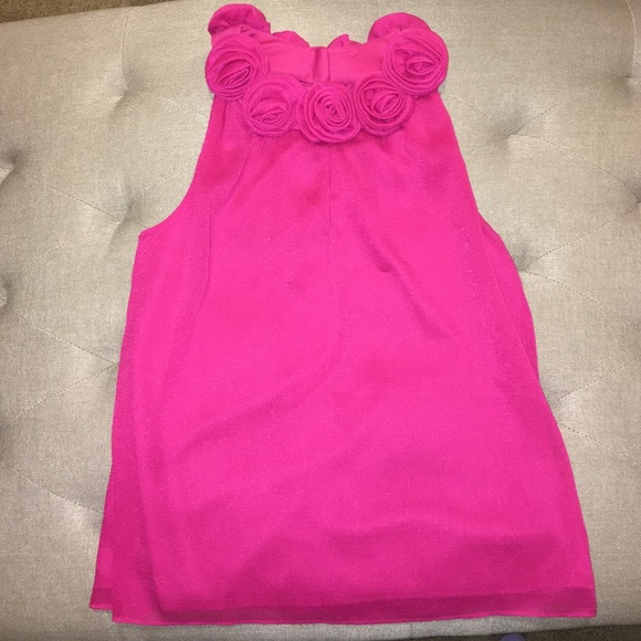 Gorgeous bright pink top with floral neckline