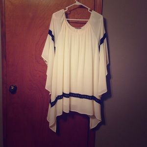 Beautiful white tunic with black trim. Nwot
