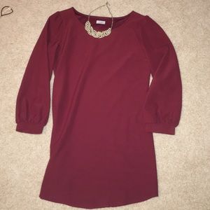 HOLDING. Love this maroon, long sleeve dress!