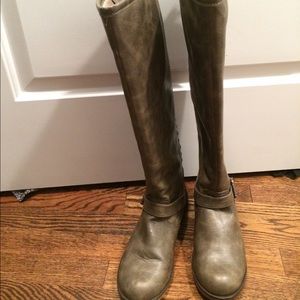 Knee high, man made boots