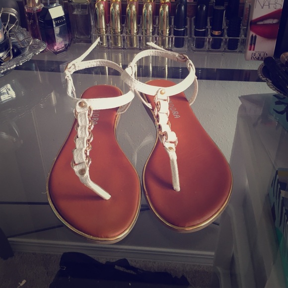 Gold and white sandals