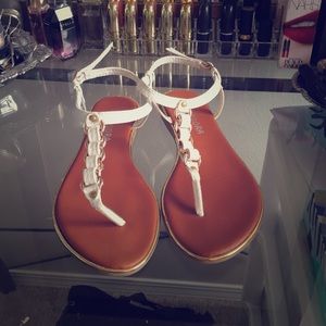 Gold and white sandals