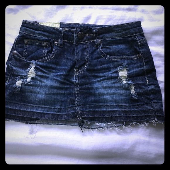 Distressed denim mini skirt