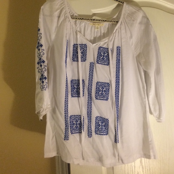 Francesca's white and blue shirt