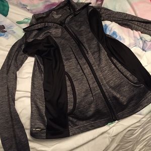 Zip up athletic long sleeve shirt.