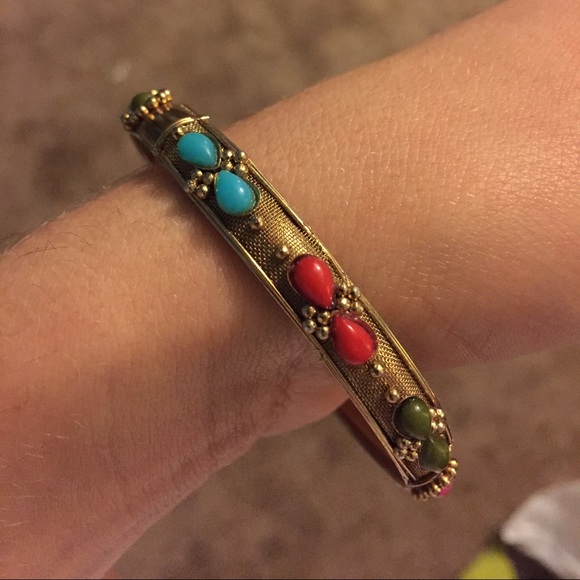 Gold bangle with colorful accents