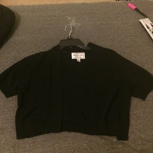 A black coverup jacket