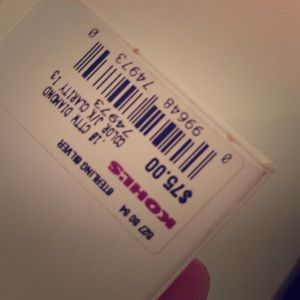 A pair of sterling silver diamond hoop earrings.