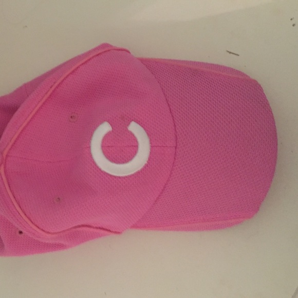 A cubbies pink baseball cap