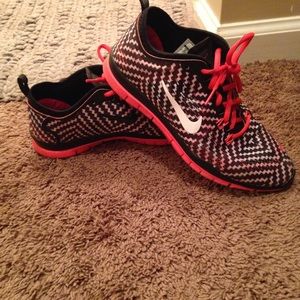 Red/black nike sneakers.