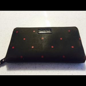 Kate Spade brown material wallet with red.