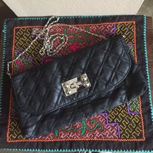Street level black quilted clutch