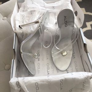 Clear strappy heels with rhinestone detail
