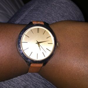 Large gold faced watch with brown leather band