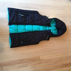 a reversable teal and black ivivva vest
