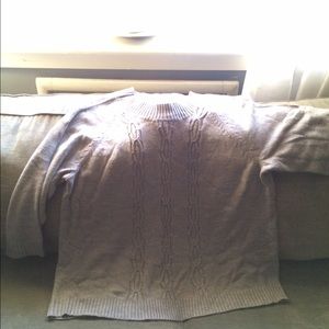 Grey cable knit sweater.