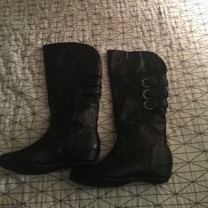 Tall black buckles boots