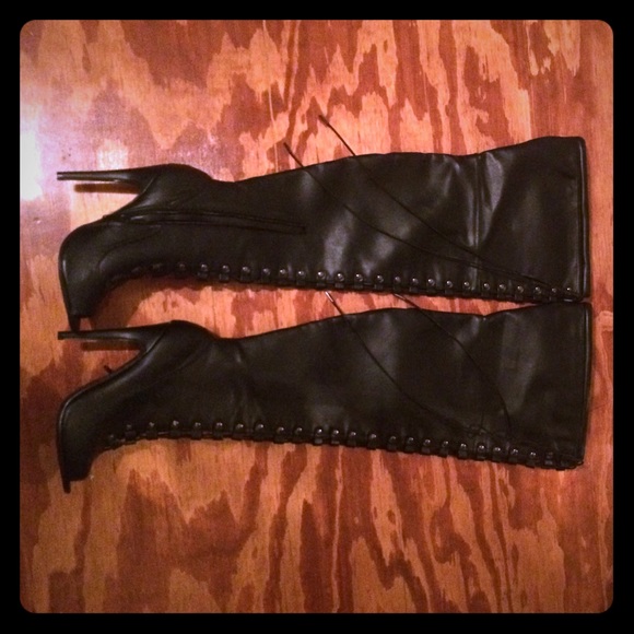 Thigh high, lace up, heeled boots