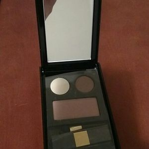 Elizabeth Arden eye-shadow, blush and brush.