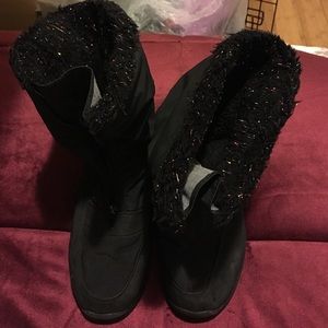 Black winter boots or rain boots.