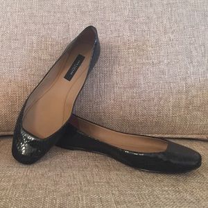 Ann Taylor black snakeskin flats.