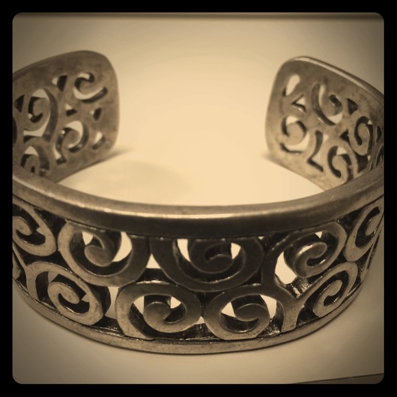 Silver toned swirl bangle metal