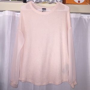 sweater with sheer sleeves.